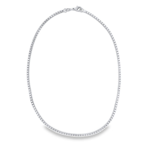 A sleek sterling silver box chain necklace lies in a neat oval shape against a clean white background.