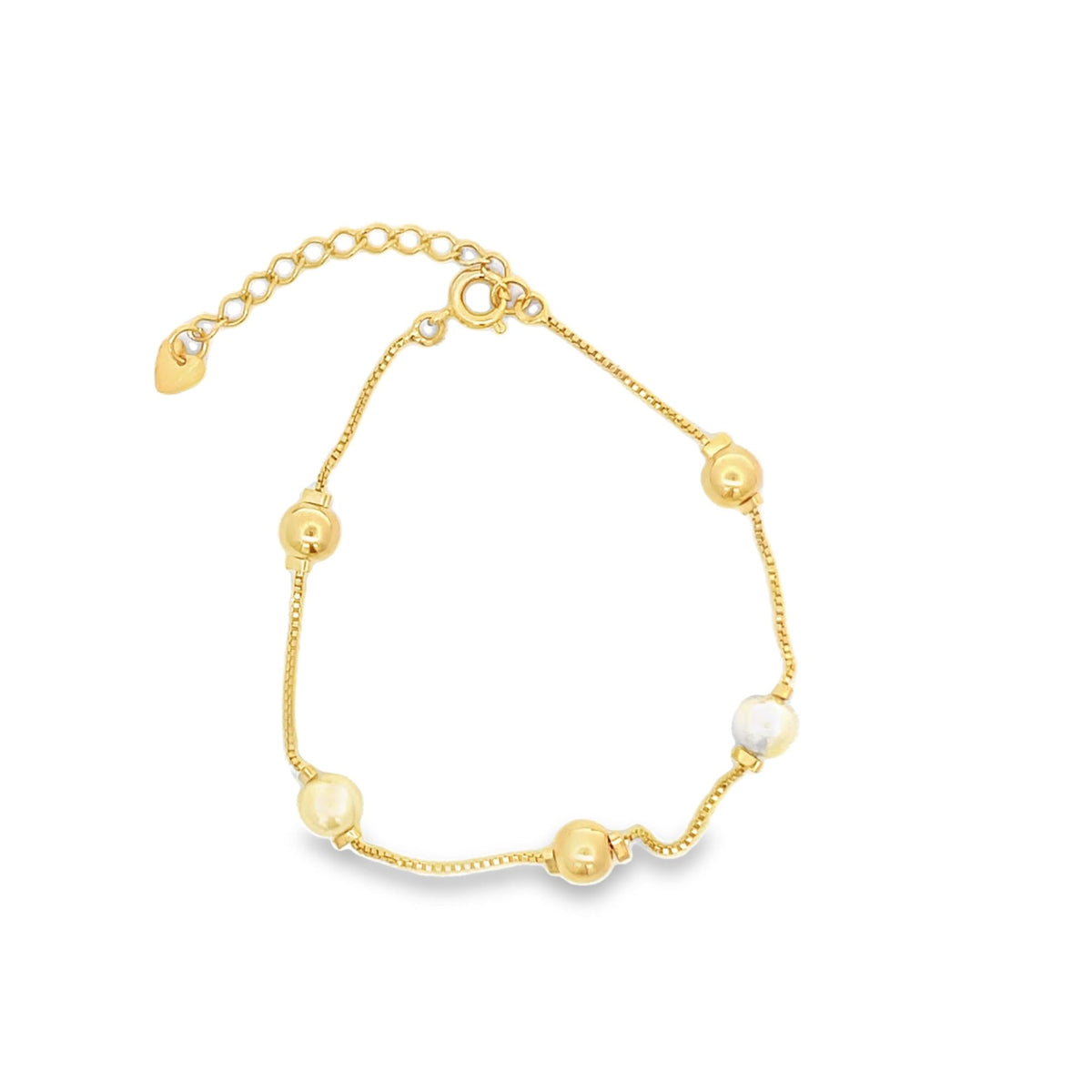 A delicate gold chain bracelet features interspersed gold beads and a pearl charm against a clean white background.