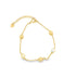 A delicate gold chain bracelet features interspersed gold beads and a pearl charm against a clean white background.