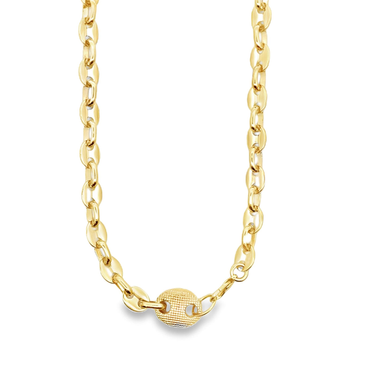 A gleaming gold mariner link necklace rests in a graceful curve against a plain white background.