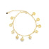 A delicate gold charm bracelet displays hanging coin pendants against a white background.