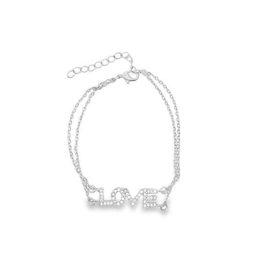 A delicate silver double-strand chain bracelet features a sparkling rhinestone-embellished "LOVE" charm in the center.