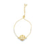 A gold seashell slider bracelet adorned with sparkling cubic zirconia crystals and colorful gemstone accents rests against a clean white background.