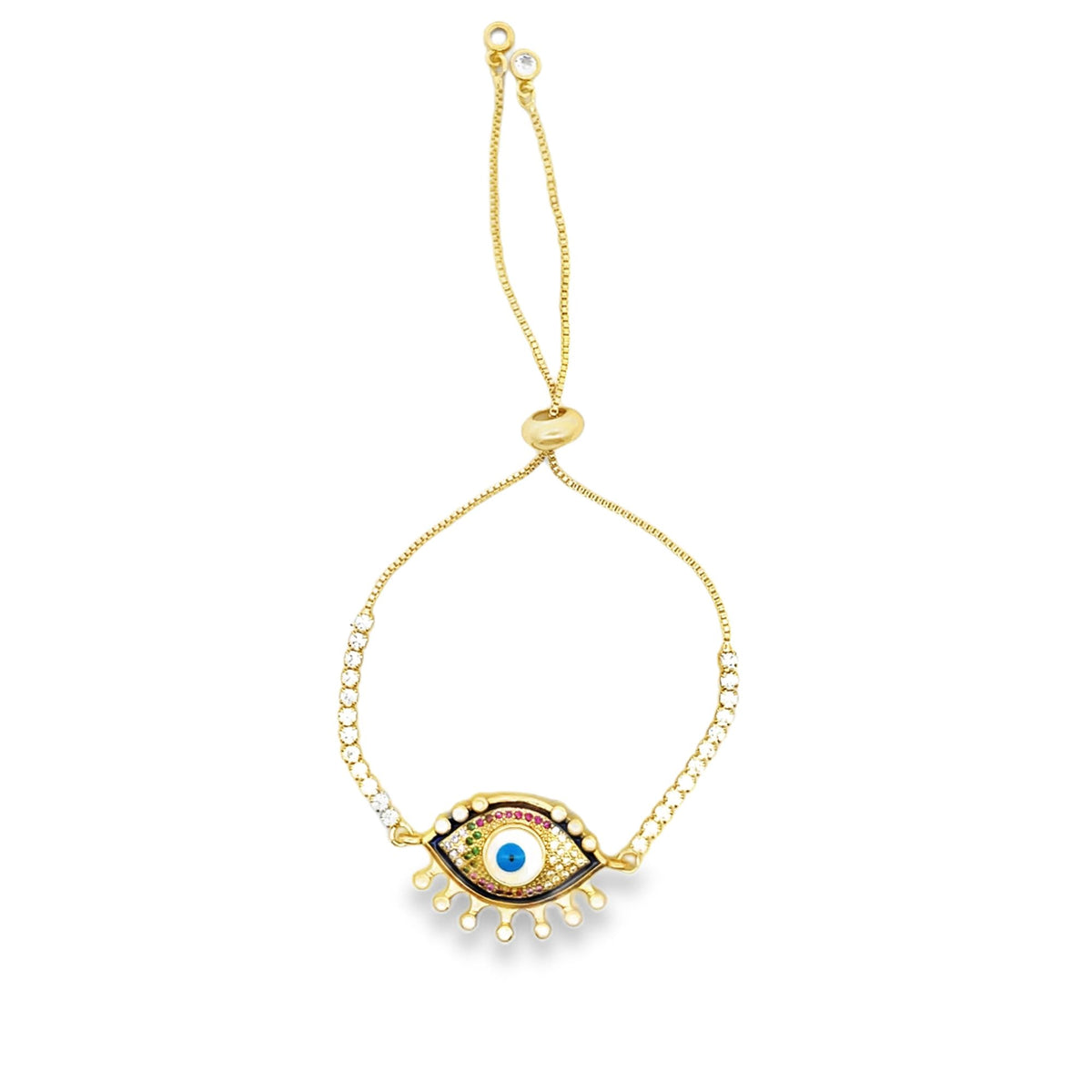 A delicate gold adjustable bolo bracelet features a vibrant evil eye charm encrusted with colorful stones and sparkling cubic zirconia along the chain.
