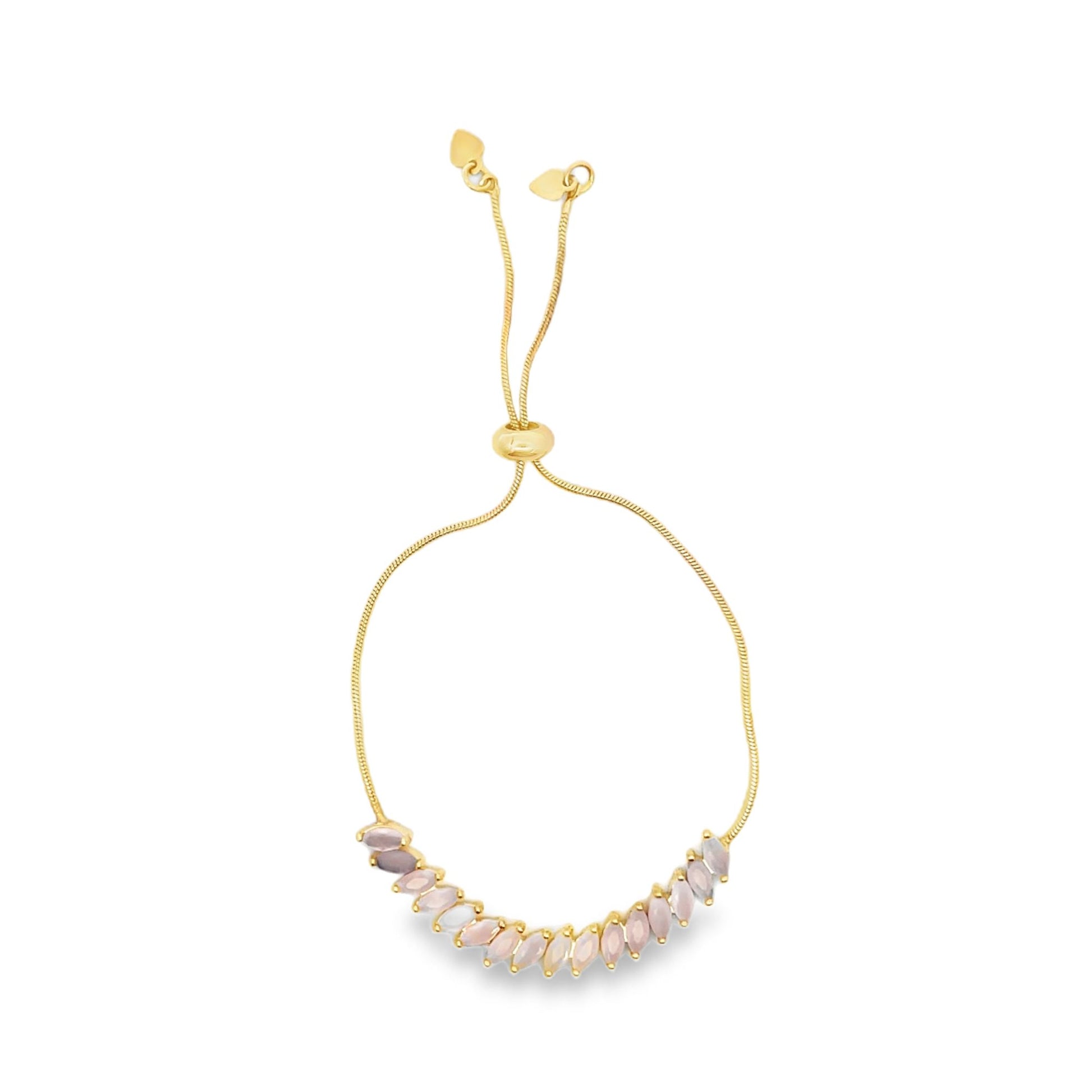 A delicate gold bolo bracelet features a curved row of marquise-cut pink stones and an adjustable slider clasp.