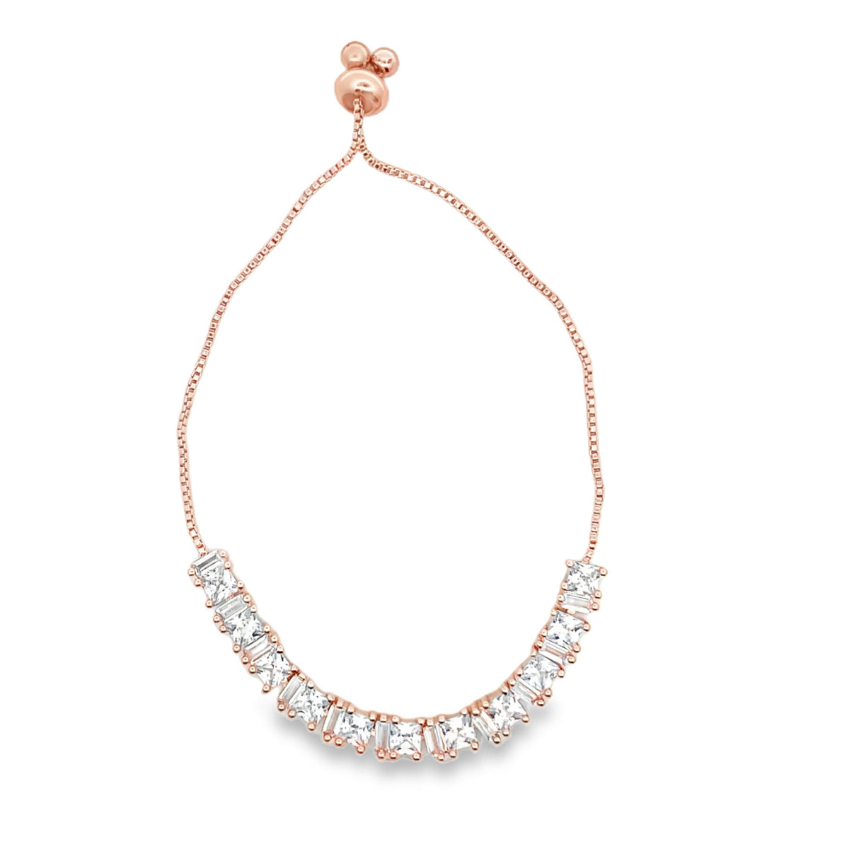 A delicate rose gold adjustable bolo bracelet features a curved line of sparkling cubic zirconia stones.