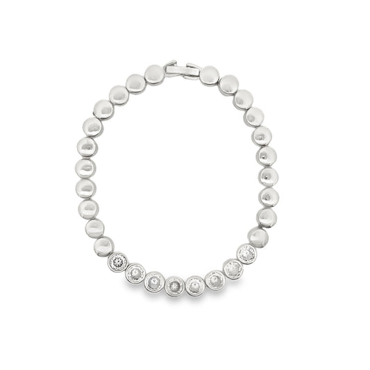 A silver link bracelet features a row of sparkling bezel-set diamonds accented by smooth metal beads.