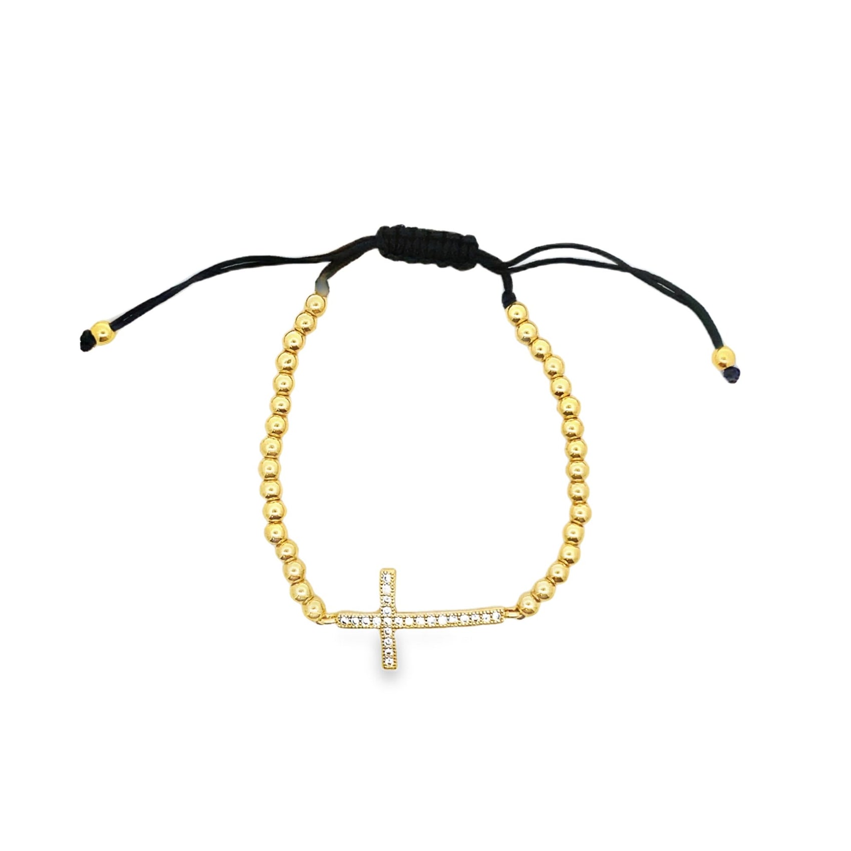 A gold bead adjustable bracelet features a sparkling crystal-encrusted cross charm centered on a white background.