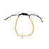 A gold bead adjustable bracelet features a sparkling crystal-encrusted cross charm centered on a white background.