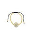 A delicate gold beaded bracelet features a sparkling multi-colored evil eye pendant on a black adjustable cord.