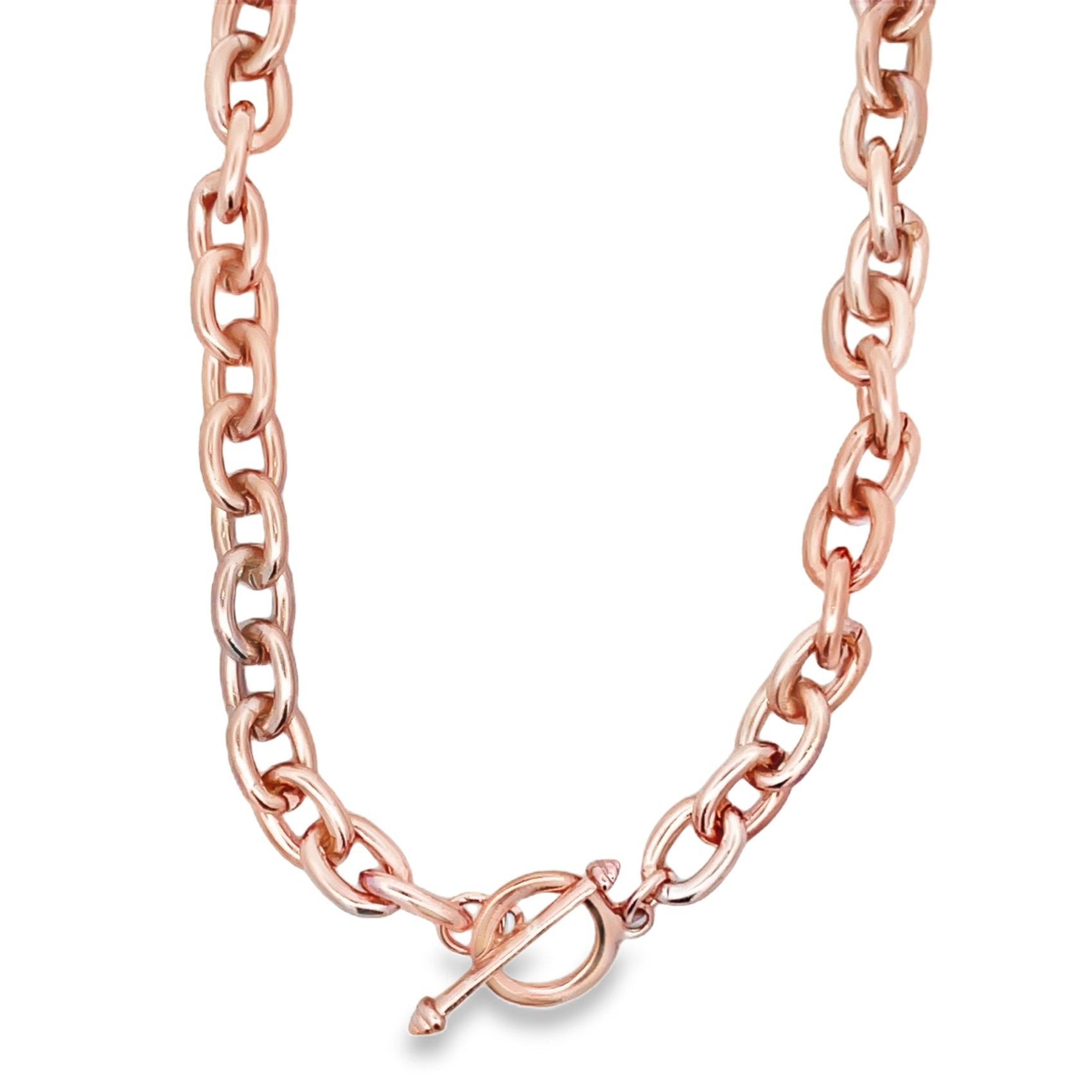 A thick rose gold chunky link necklace rests against a white background, featuring a prominent toggle clasp at the front.