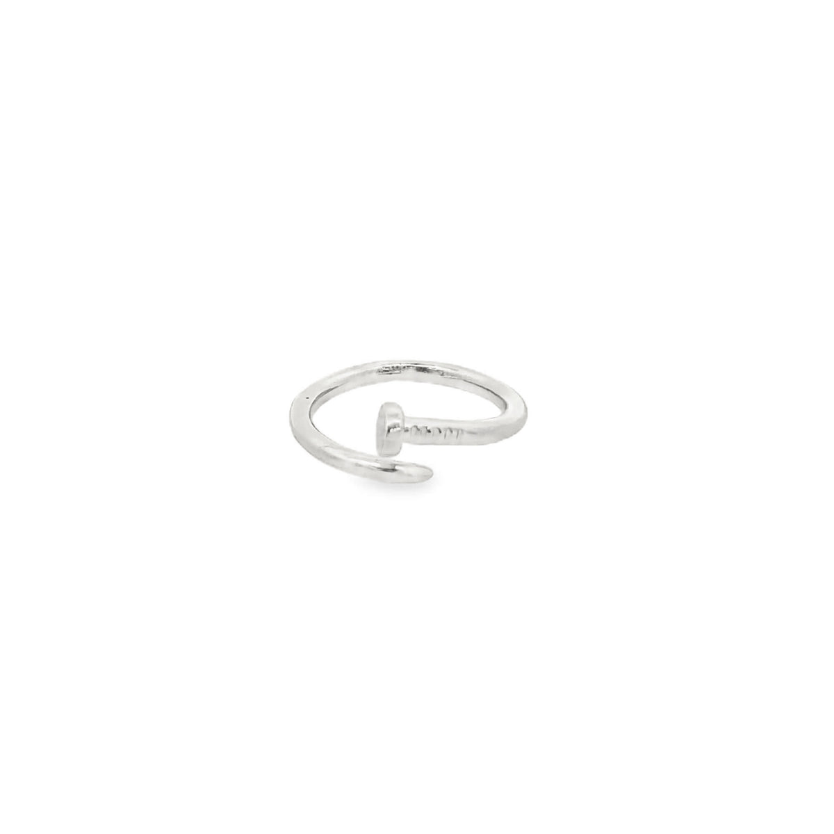 A polished silver nail ring rests on a clean white background.