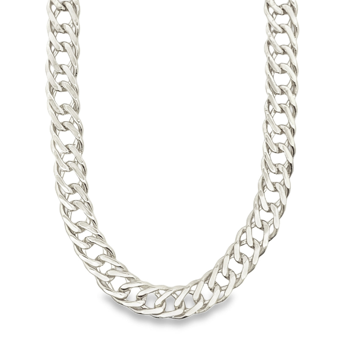 A thick, polished silver curb chain necklace rests gracefully against a clean white background.