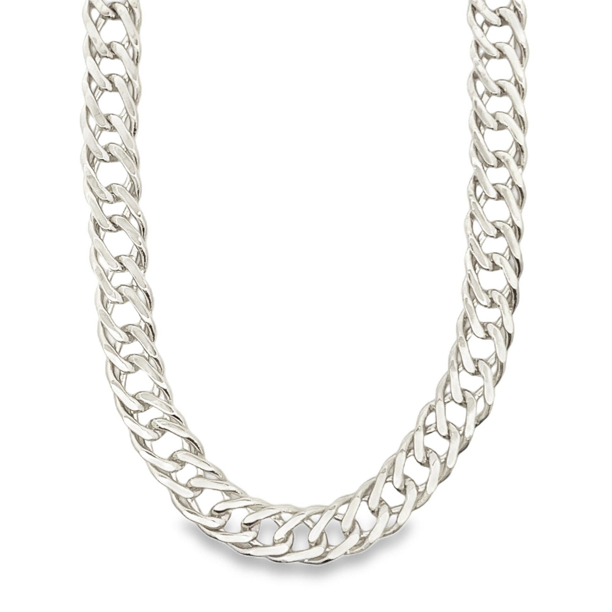 A thick, polished silver curb chain necklace rests gracefully against a clean white background.