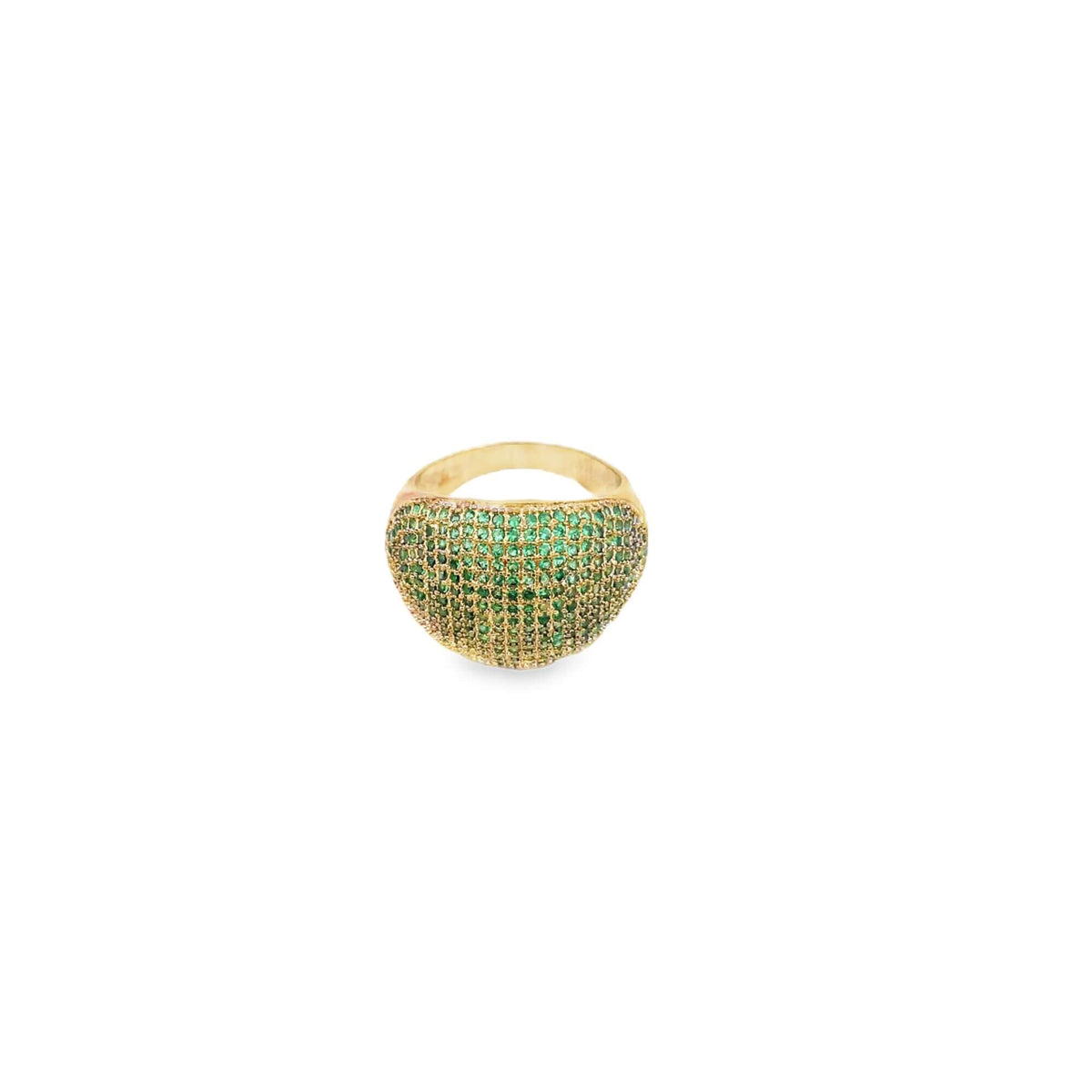 A dome-shaped gold ring sparkles with pavé-set green gemstones against a clean white background.