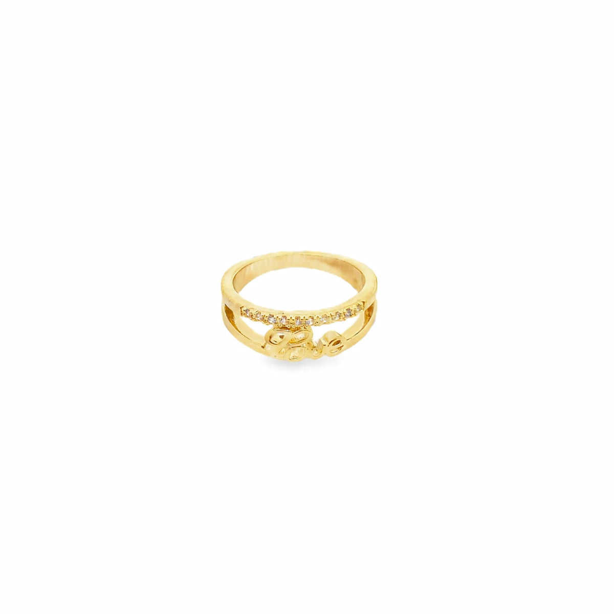 A delicate gold ring featuring a sparkling rhinestone-embellished band and the word "Love" script centerpiece rests against a clean white background.