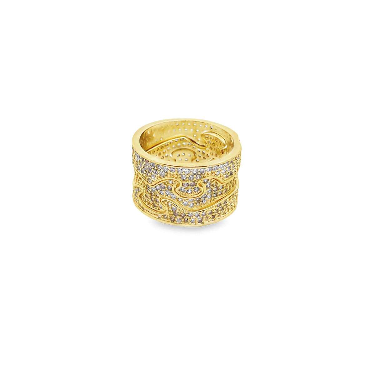 A wide gold band ring sparkles with pave-set diamonds along its textured, interlocking wave design against a plain white background.