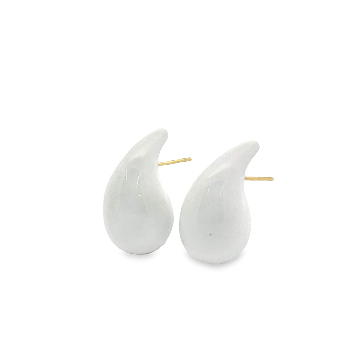 A pair of glossy white teardrop-shaped ceramic stud earrings resting against a clean white background.