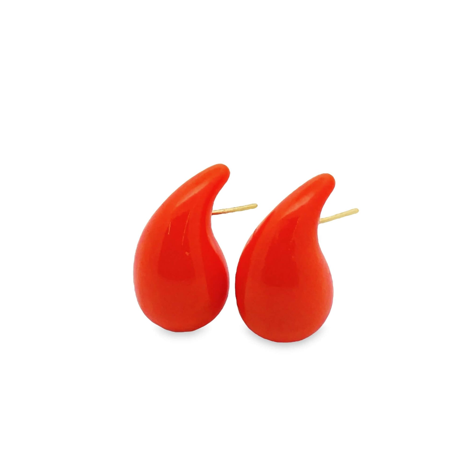 A pair of vibrant red teardrop stud earrings displays a glossy finish against a clean white background.