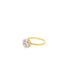 A gold solitaire ring with a sparkling round-cut diamond rests on a clean white background.