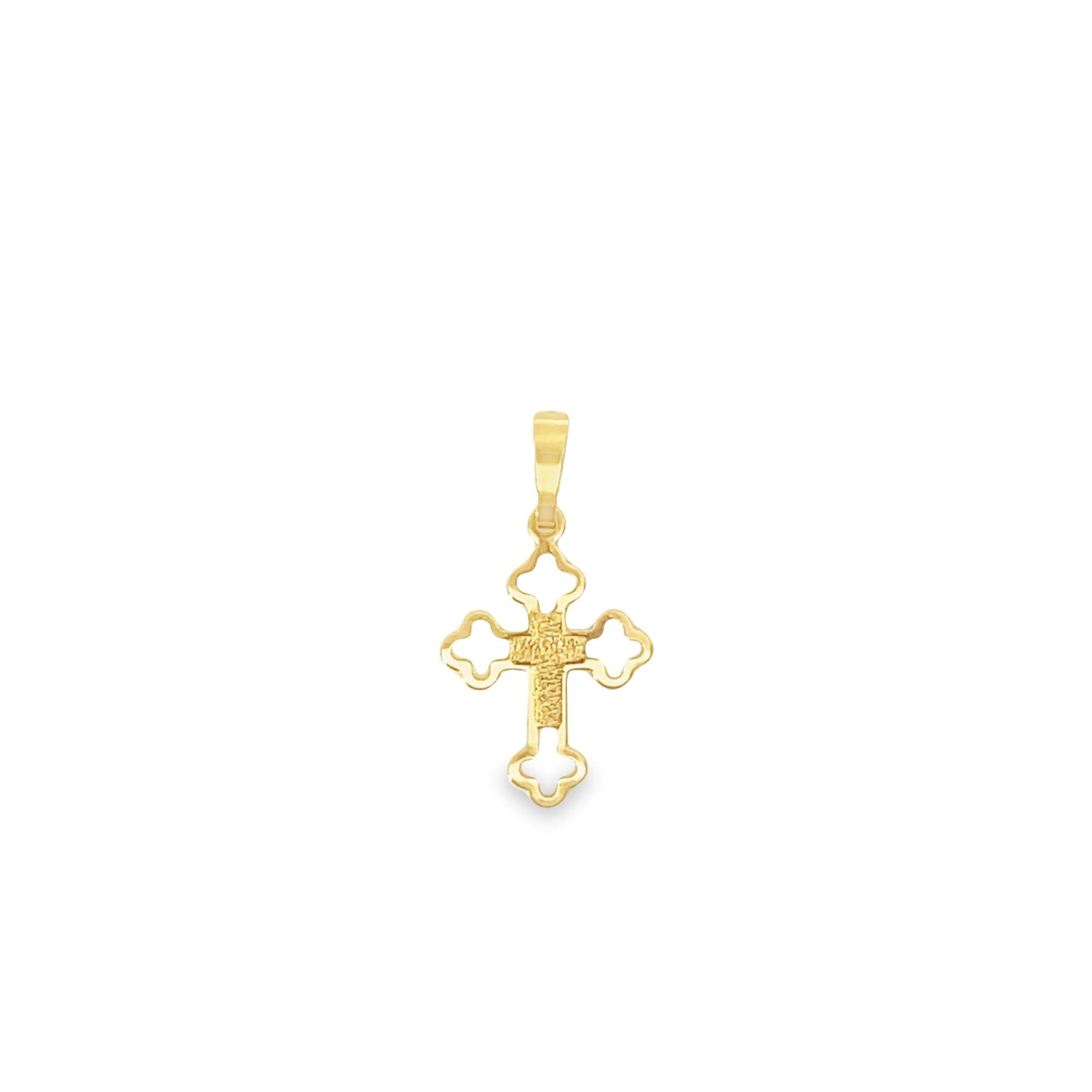 A small gold cross pendant features an intricate filigree design against a plain white background.
