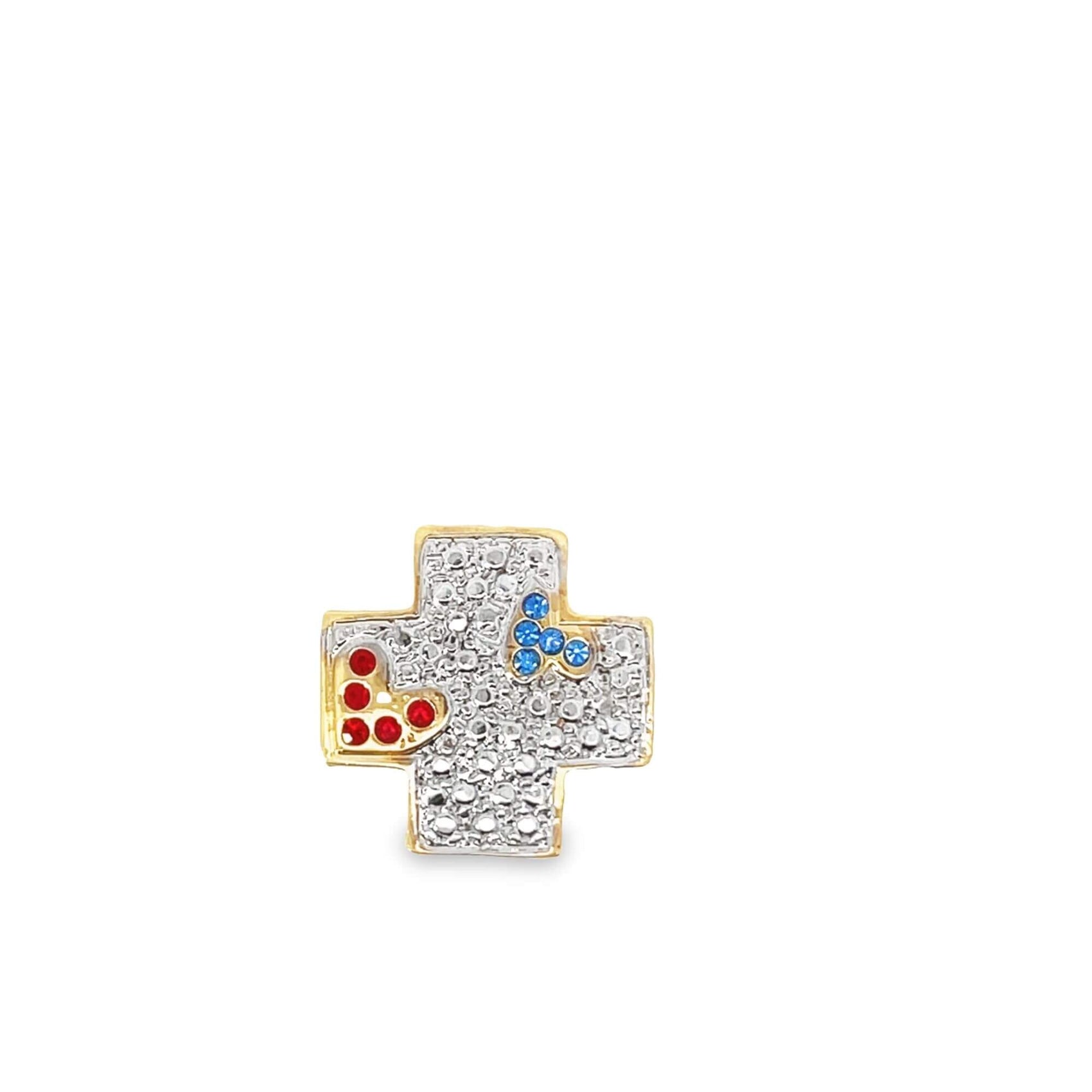 A gold cross pendant encrusted with clear, red, and blue crystals sits against a clean white background.