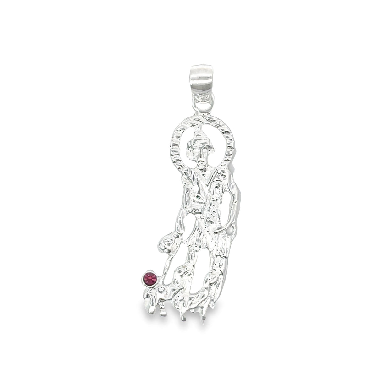 A sterling silver San Judas pendant gleams against a white background, featuring the saint with a halo and a single red gemstone accent.