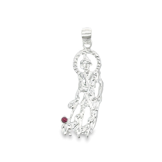 A sterling silver San Judas pendant gleams against a white background, featuring the saint with a halo and a single red gemstone accent.