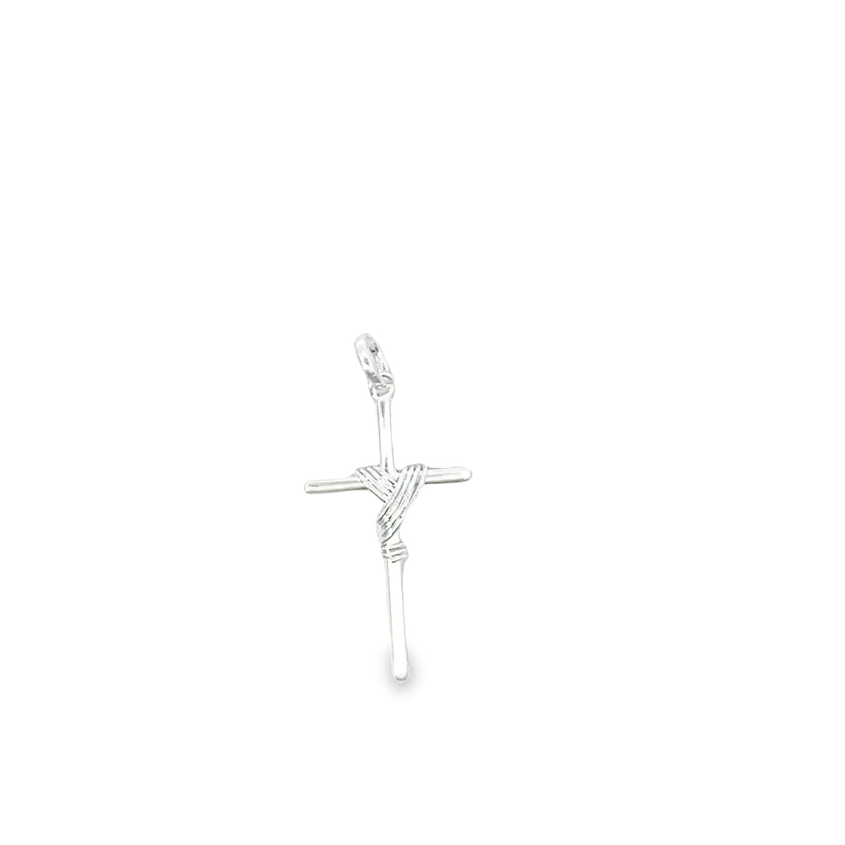 A delicate silver cross pendant features intricate wire wrapping at its center against a plain white background.