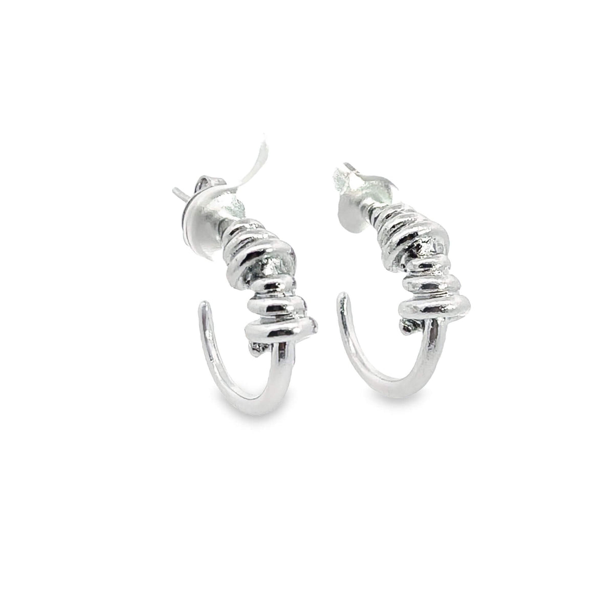A pair of silver hoop earrings features textured, coiled bead details against a clean white background.