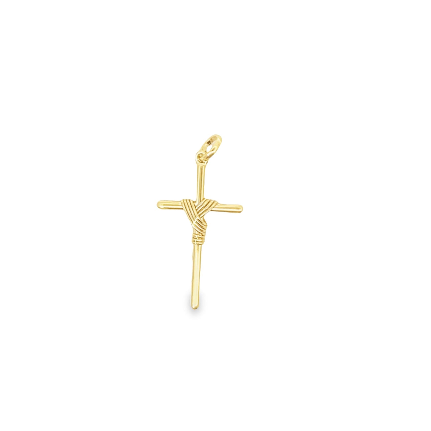A gold cross pendant features a detailed wire-wrapped center against a clean white background.