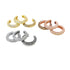 Three sets of pavé-set huggie hoop earrings in yellow gold, rose gold, and silver display sparkling crystal details against a white background.