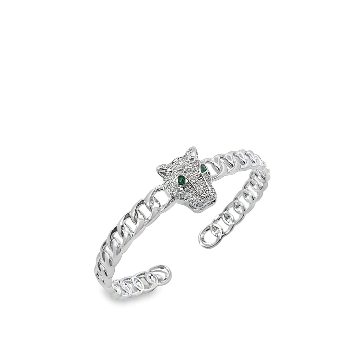 A silver cuban link cuff ring showcases a sparkling panther head centerpiece with vibrant green gemstone eyes.