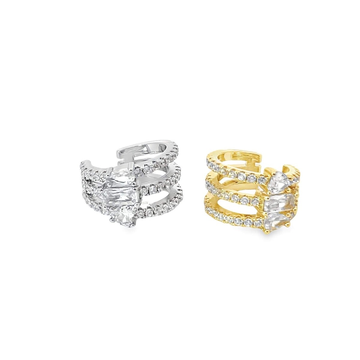 A silver and a gold multi-band ear cuff sparkle with encrusted cubic zirconia stones against a clean white background.