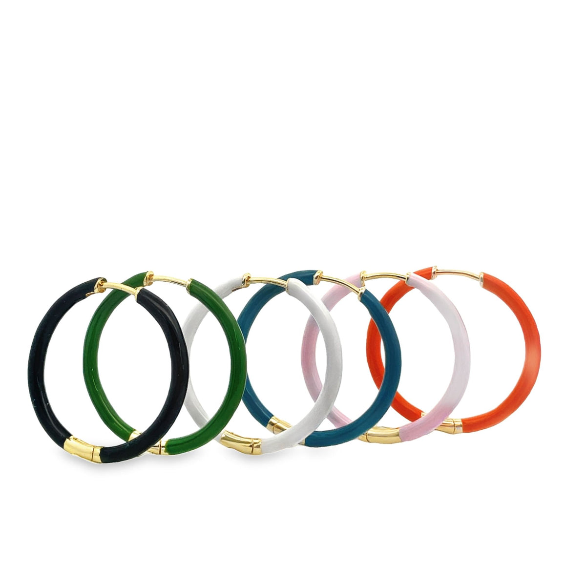 A row of colorful enamel hoop earrings in black, green, white, blue, pink, and orange rests against a white background.