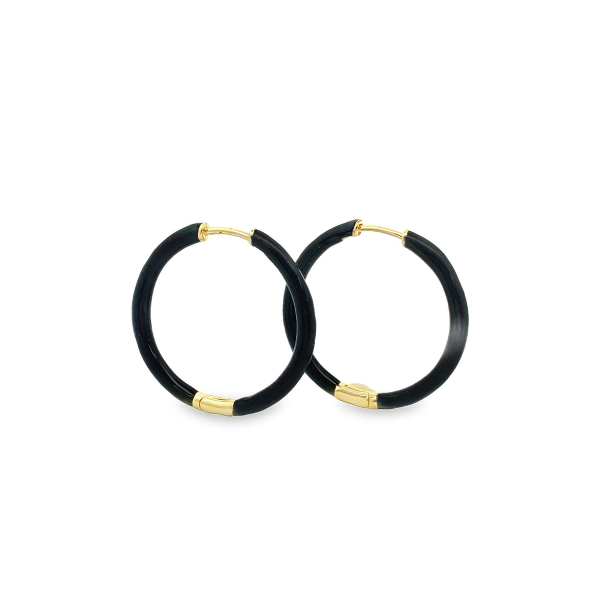 A pair of elegant black enamel hoop earrings with gold accents rests against a clean white background.