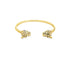 A gold cuff bracelet features sculpted leopard heads with black enamel spots at each open end.