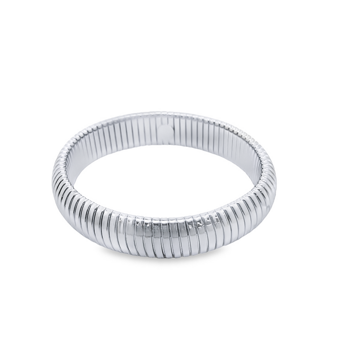 A polished silver metal ribbed ring sits against a clean white background.
