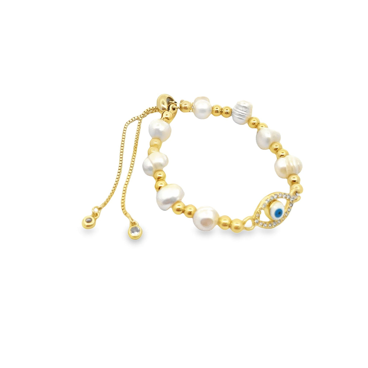 A gold evil eye slider bracelet features white pearls and gold beads against a clean white background.