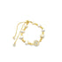 A gold slider bracelet features alternating freshwater pearls and gold beads alongside a sparkling evil eye charm.