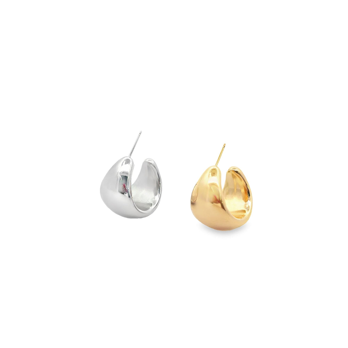 A pair of chunky silver and gold teardrop hoop earrings rest against a clean white background.