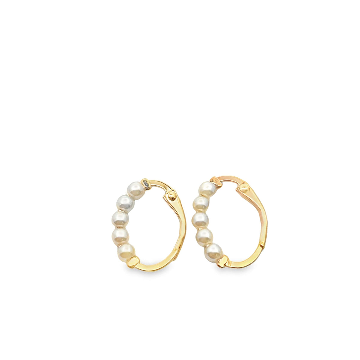 A pair of gold hoop earrings embellished with small white pearls sits against a plain white background.