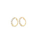 A pair of gold hoop earrings embellished with small white pearls sits against a plain white background.