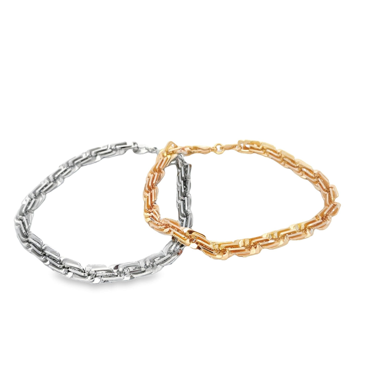 Two interlocking linked chain bracelets, one crafted from silver and the other from gold, rest against a clean white background.