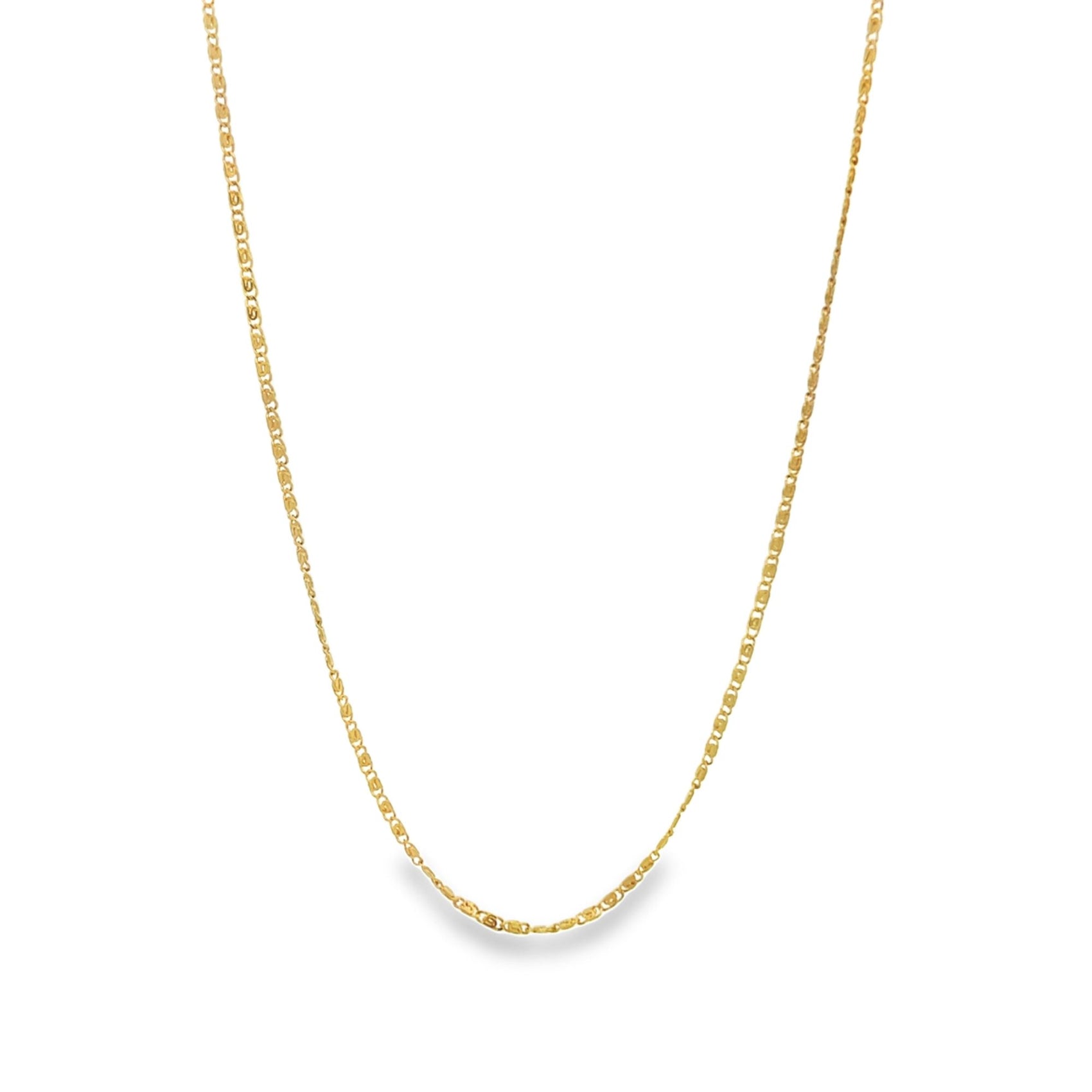 A delicate gold chain necklace hangs against a clean white background.
