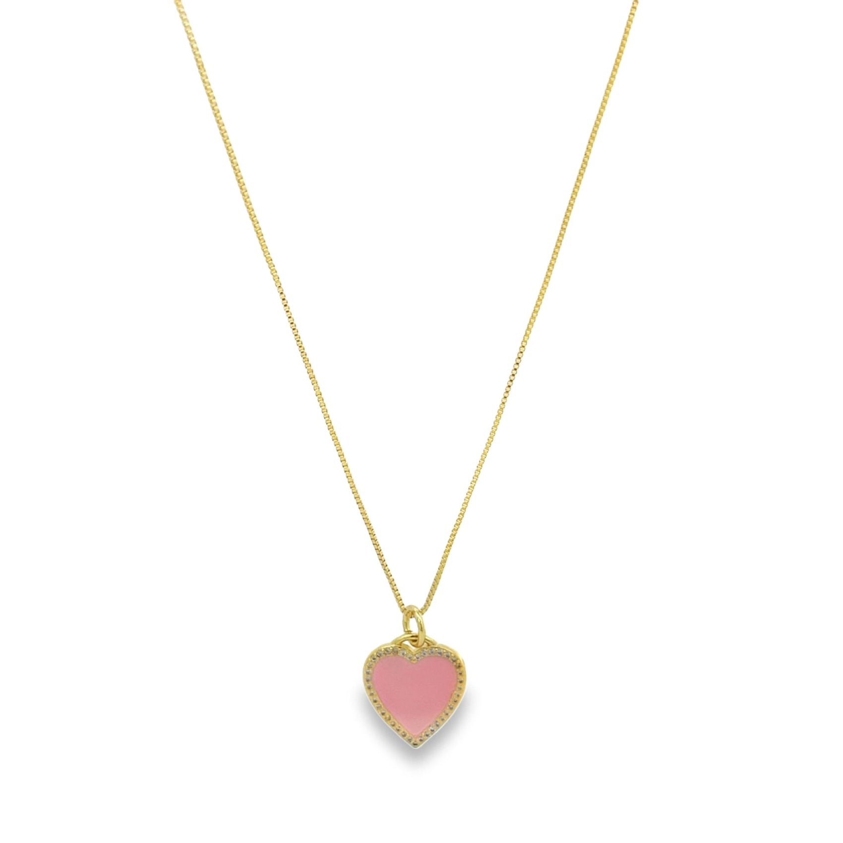 A delicate gold chain necklace dangles, featuring a charming pink enamel heart pendant edged with sparkling pave crystals.