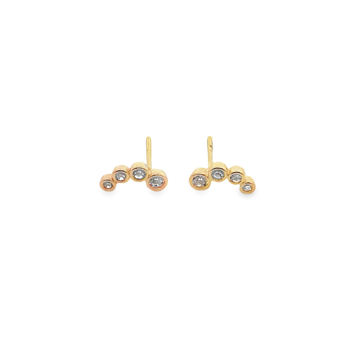A pair of delicate gold cluster stud earrings features a curved line of bezel-set diamonds against a clean white background.