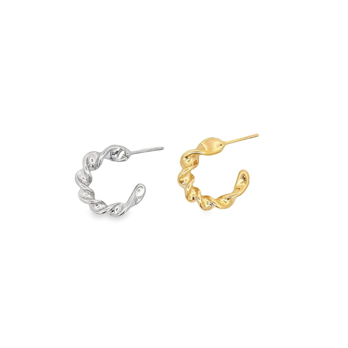 A pair of silver and gold twisted hoop earrings rest on a clean white background.