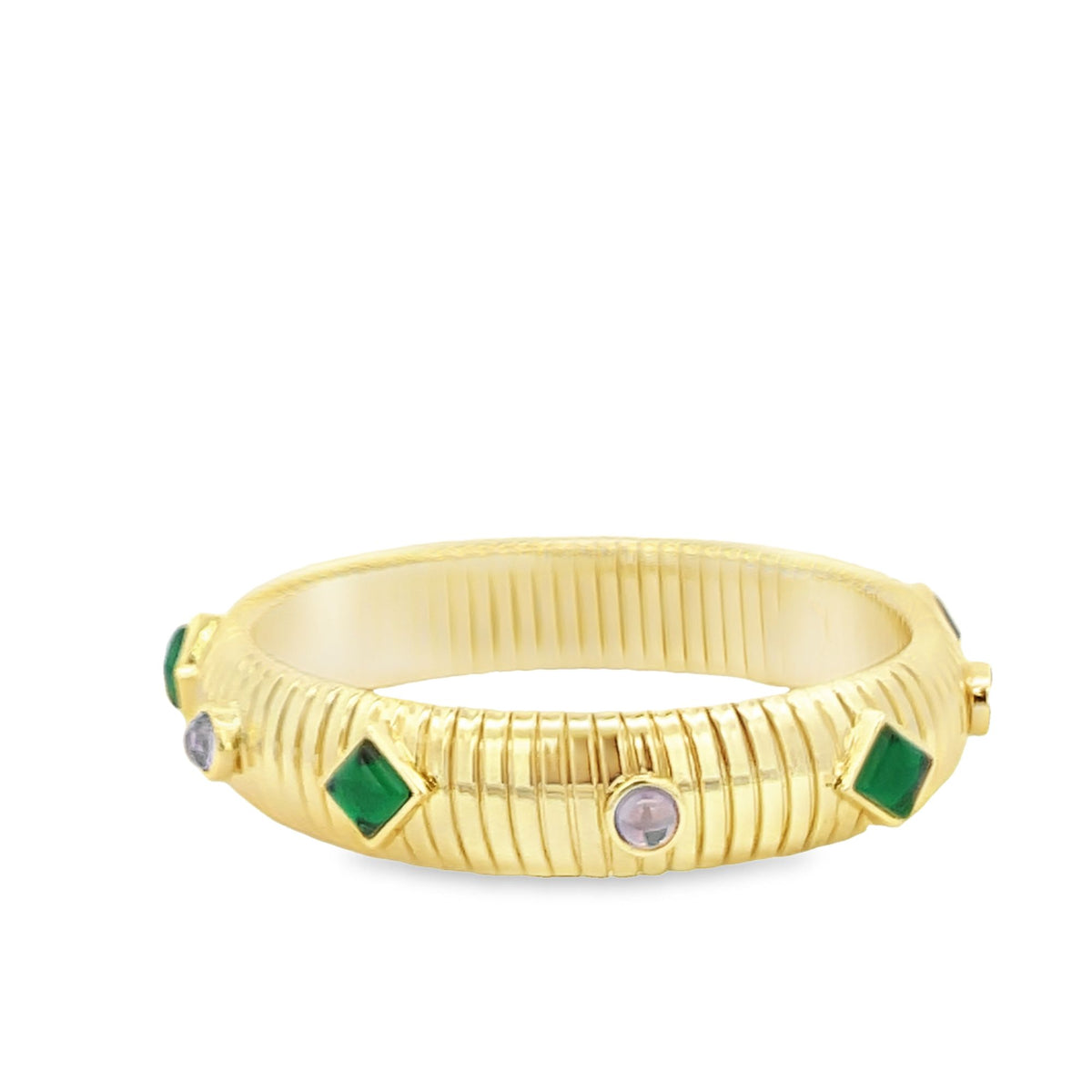 A ribbed gold bangle bracelet features alternating green square stones and round purple gemstones.
