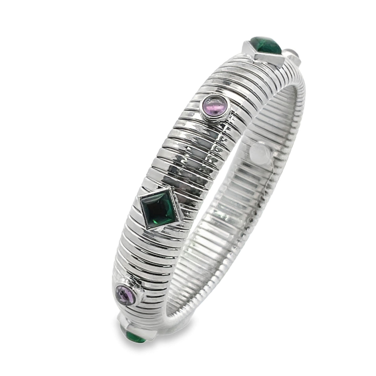 A ribbed silver bangle bracelet features alternating green and pink gemstones.